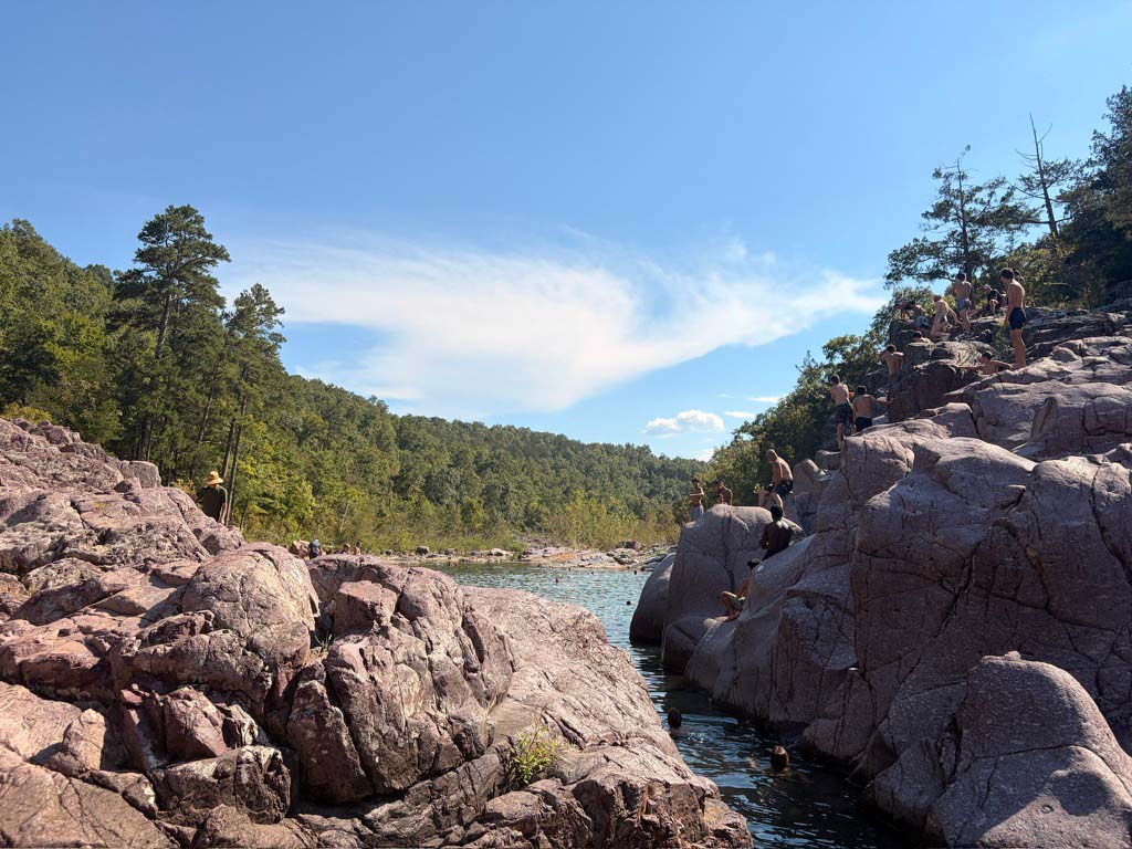 People swimming and climbing on the rocks at Johnson's Shut-Ins State Park